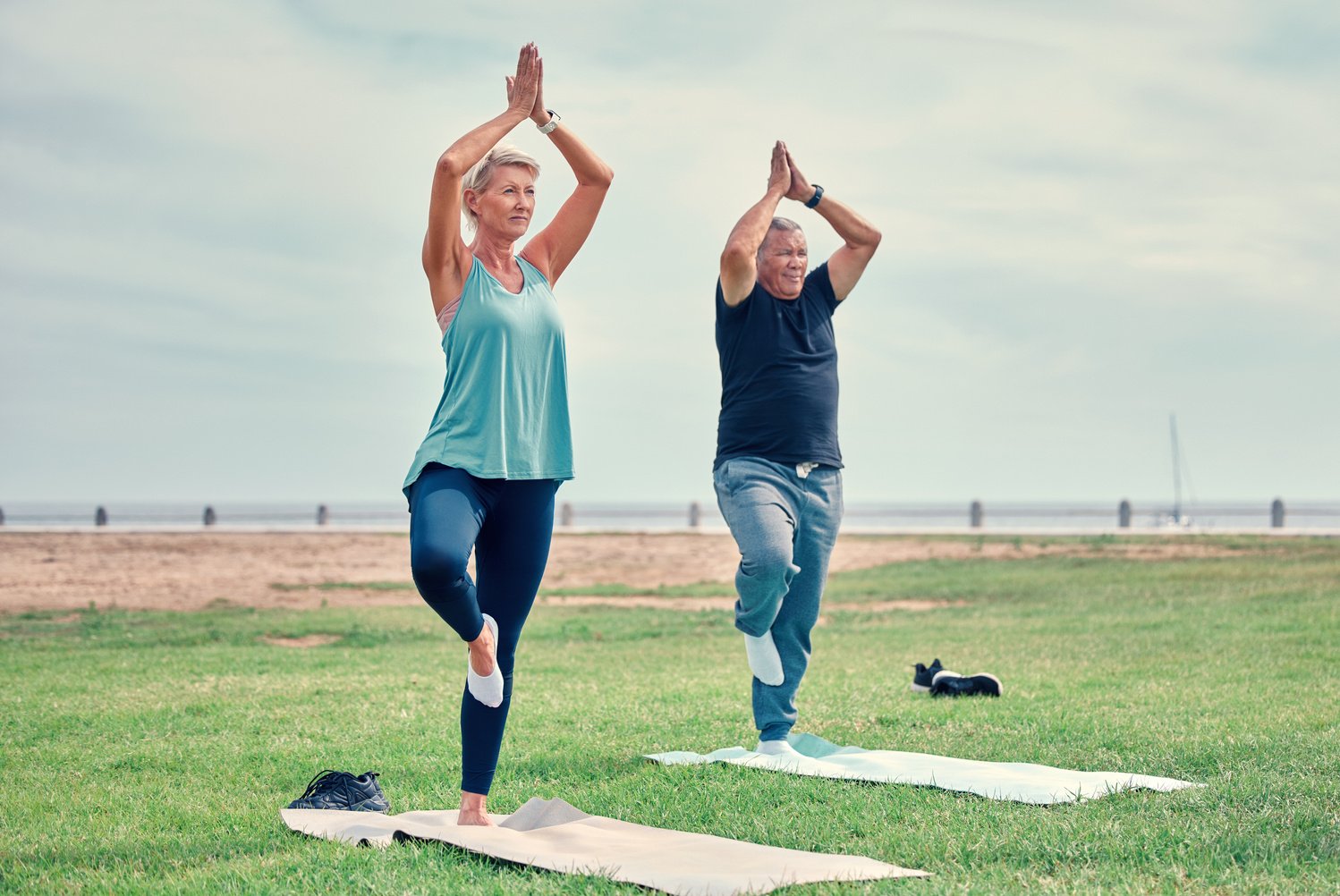 Yoga, Fitness and Senior Couple Wellness in Park Zen, Holistic Meditation or Retirement Health for Calm Mind. Mountain Pose, Tadasana or Prayer of Elderly People Training, Learning Pilates or Workout