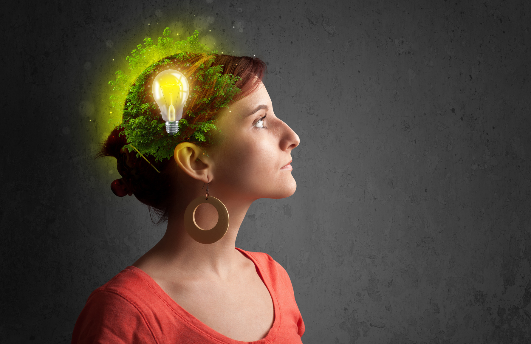 Young mind thinking of green eco energy with lightbulb